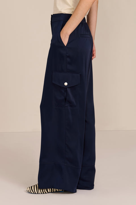 women's satin-finish wide-leg cargo pants with flap pockets and silver-tone snap hardware.