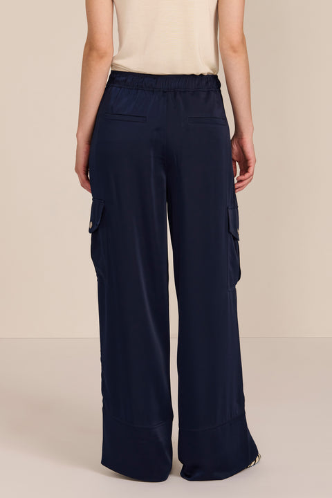 women's satin-finish wide-leg cargo pants with flap pockets and silver-tone snap hardware.