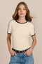 women's ivory short-sleeve ringer tee featuring black contrast trim and blue stripes along the shoulders and sleeves.