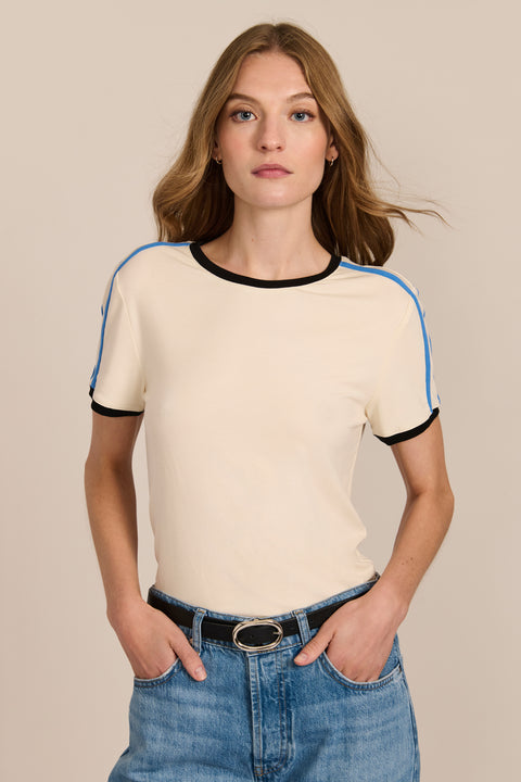 women's ivory short-sleeve ringer tee featuring black contrast trim and blue stripes along the shoulders and sleeves.