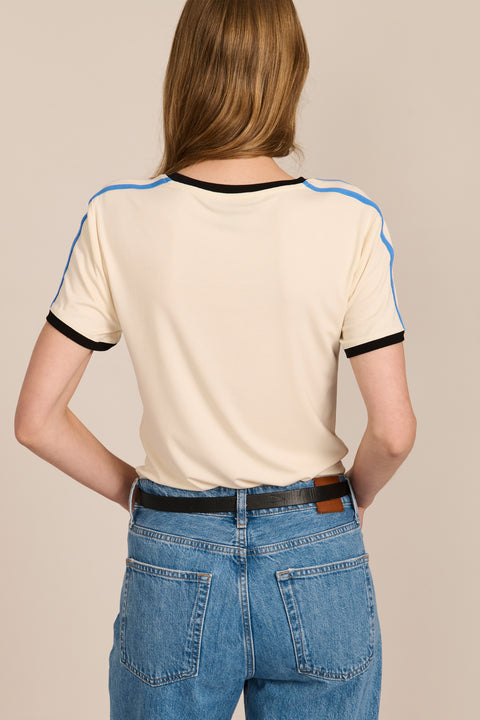 women's ivory short-sleeve ringer tee featuring black contrast trim and blue stripes along the shoulders and sleeves.