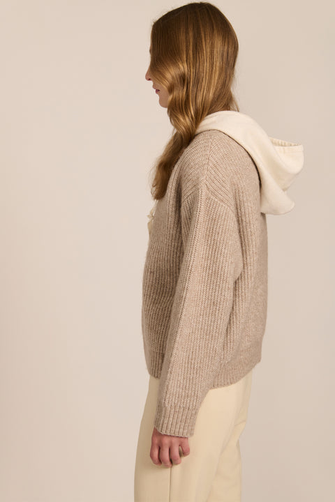 women's V-neck sweater with a contrast ivory hood, drawstrings, dropped shoulders and ribbed knit texture.