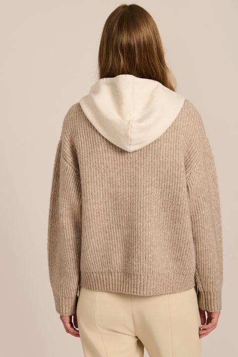 women's V-neck sweater with a contrast ivory hood, drawstrings, dropped shoulders and ribbed knit texture.