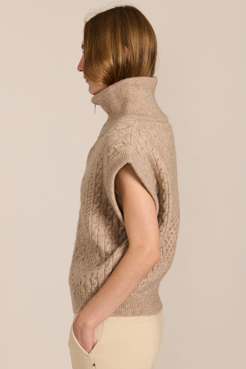 women's cable knit quarter-zip sweater vest with ribbed funnel collar, textured cable stitching and relaxed cap sleeves.
