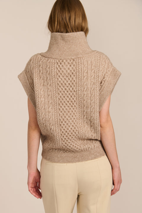 women's cable knit quarter-zip sweater vest with ribbed funnel collar, textured cable stitching and relaxed cap sleeves.