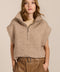 women's cable knit quarter-zip sweater vest with ribbed funnel collar, textured cable stitching and relaxed cap sleeves.