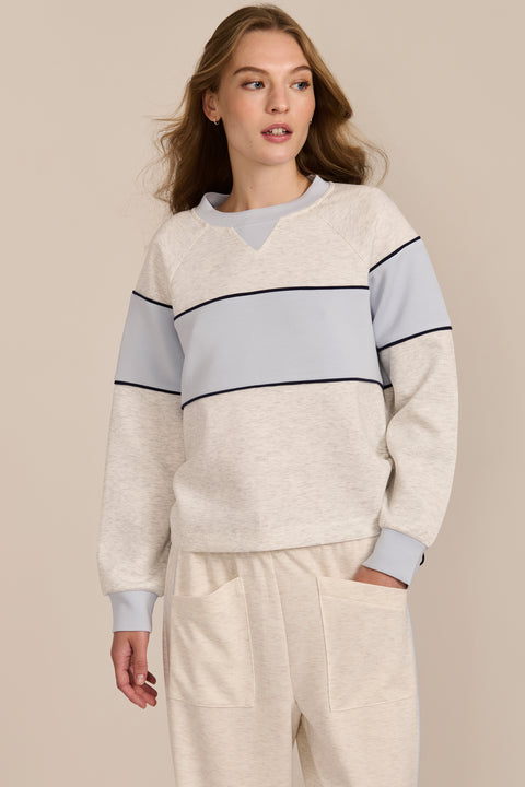 Women's navy and blue colorblock soft scuba sweatshirt with contrast piping and crew neckline.