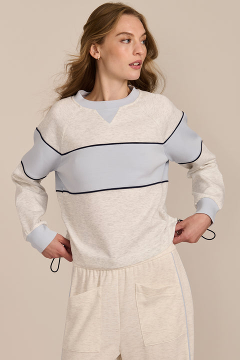 Women's navy and blue colorblock soft scuba sweatshirt with contrast piping and crew neckline.