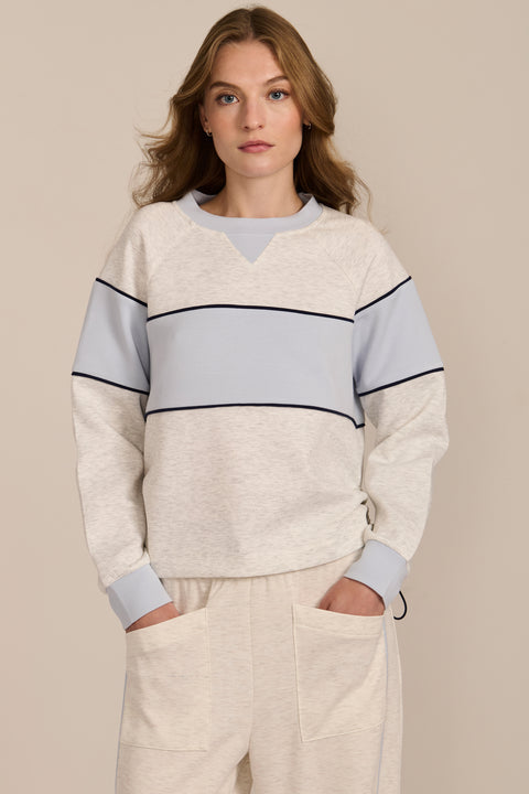 Women's navy and blue colorblock soft scuba sweatshirt with contrast piping and crew neckline.