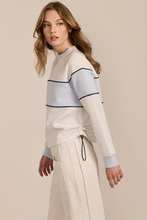 Women's navy and blue colorblock soft scuba sweatshirt with contrast piping and crew neckline.