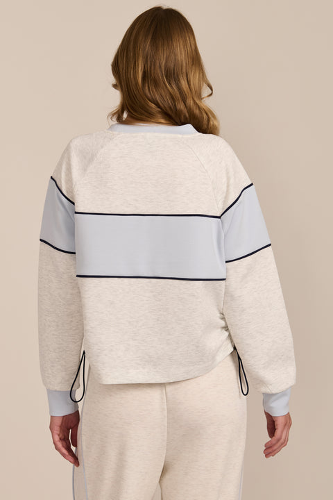 Women's navy and blue colorblock soft scuba sweatshirt with contrast piping and crew neckline.