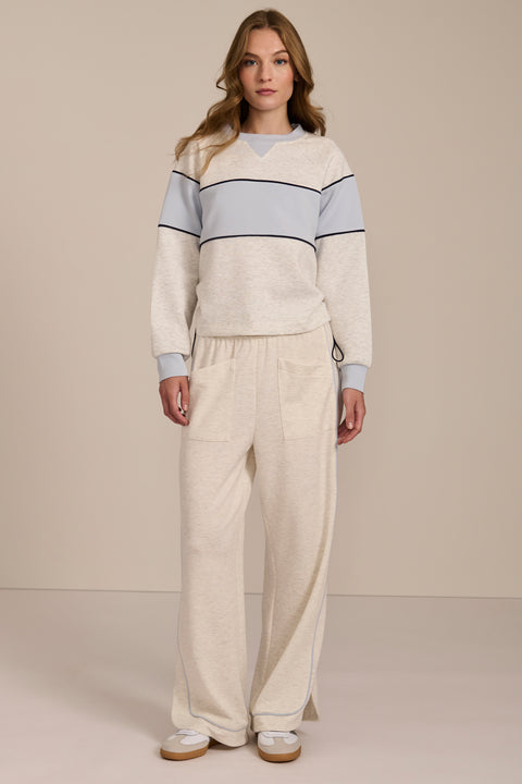 Women's navy and blue colorblock soft scuba sweatshirt with contrast piping and crew neckline.