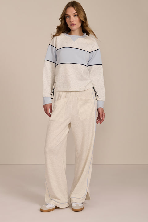 Women's navy and blue colorblock soft scuba sweatshirt with contrast piping and crew neckline.
