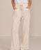 Women's soft scuba wide-leg pants with light blue piping, patch pockets, drawstring waist and side slits.