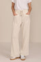 Women's soft scuba wide-leg pants with light blue piping, patch pockets, drawstring waist and side slits.