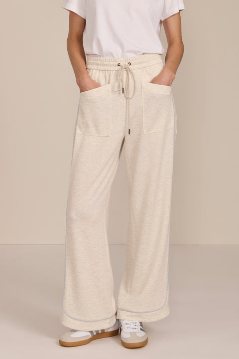Women's soft scuba wide-leg pants with light blue piping, patch pockets, drawstring waist and side slits.
