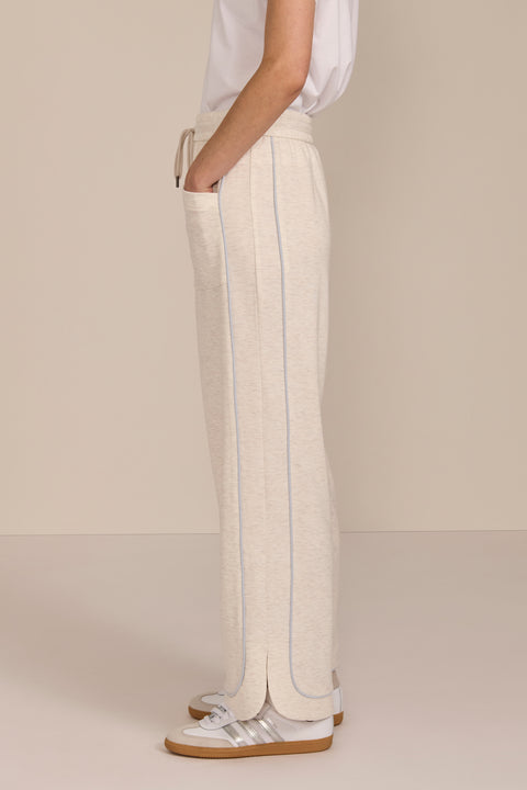 Women's soft scuba wide-leg pants with light blue piping, patch pockets, drawstring waist and side slits.
