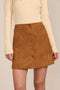 women's camel faux suede mini skirt featuring a tonal covered snap front and clean A-line silhouette.
