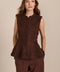 women's chocolate brown faux suede peplum top featuring a sleeveless silhouette, band collar, tonal covered buttons and flared hem.