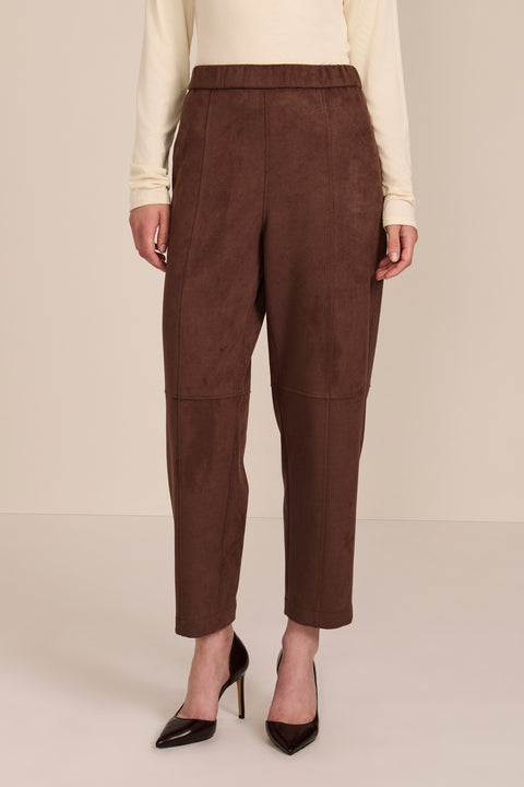 women's chocolate brown faux suede pull-on pant featuring an elasticized waistband, side pockets, seam detailing and an ankle-length silhouette.