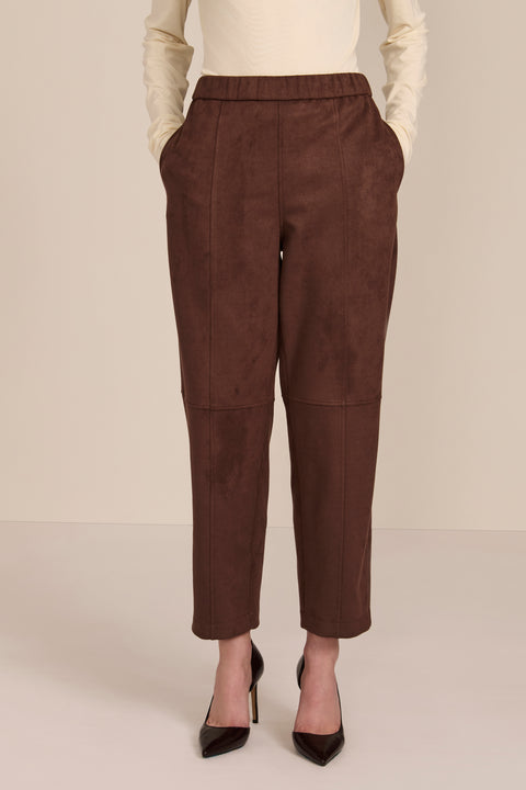 women's chocolate brown faux suede pull-on pant featuring an elasticized waistband, side pockets, seam detailing and an ankle-length silhouette.