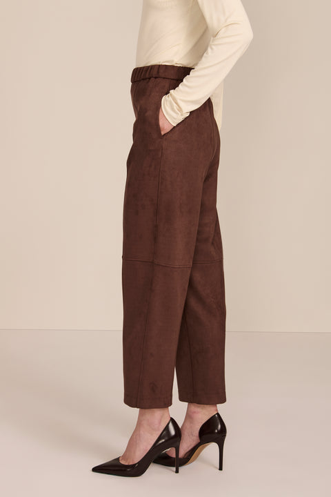 women's chocolate brown faux suede pull-on pant featuring an elasticized waistband, side pockets, seam detailing and an ankle-length silhouette.