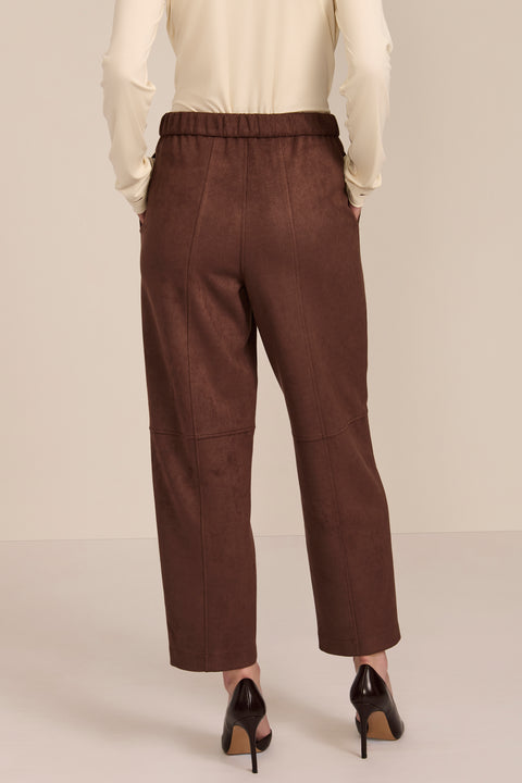 women's chocolate brown faux suede pull-on pant featuring an elasticized waistband, side pockets, seam detailing and an ankle-length silhouette.