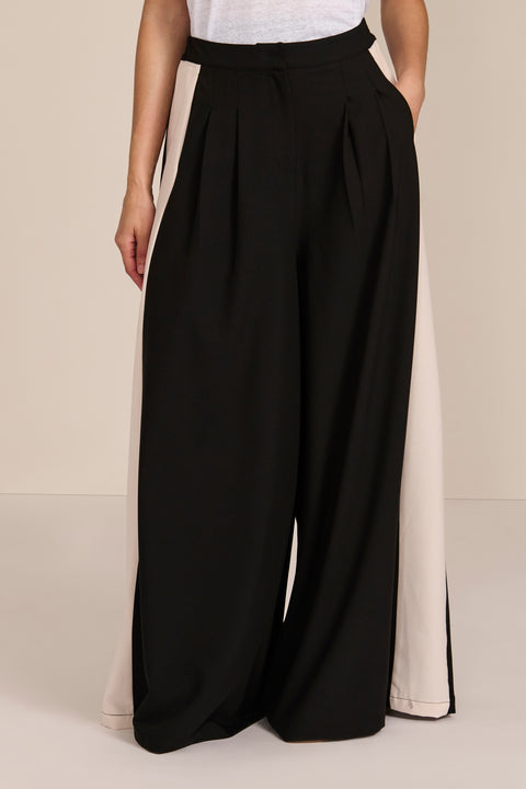 women's high-rise wide-leg pants featuring front pleats and contrasting ivory side stripes.