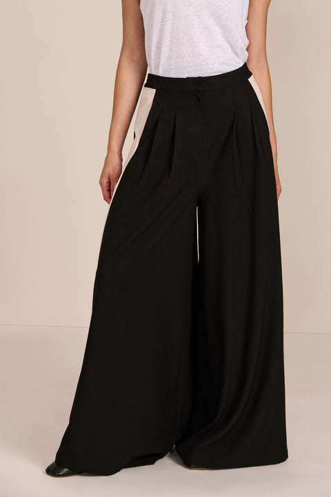 women's high-rise wide-leg pants featuring front pleats and contrasting ivory side stripes.