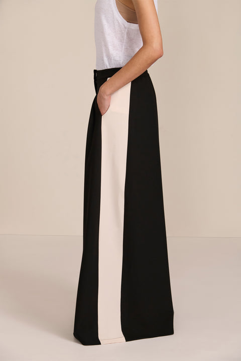 women's high-rise wide-leg pants featuring front pleats and contrasting ivory side stripes.
