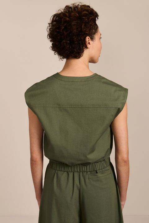 women's olive sleeveless zip-front top with V-neckline, extended shoulders and elasticized hem.