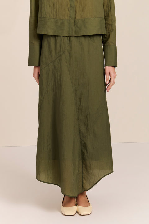 women's asymmetrical maxi skirt in olive green with a fluid silhouette and softly draped hem.