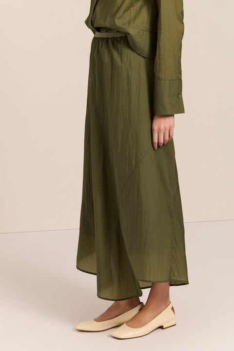 women's asymmetrical maxi skirt in olive green with a fluid silhouette and softly draped hem.