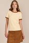 women's ivory ribbed knit short-sleeve tee featuring a crew neckline and warm brown contrast trim at the neck and cuffs.