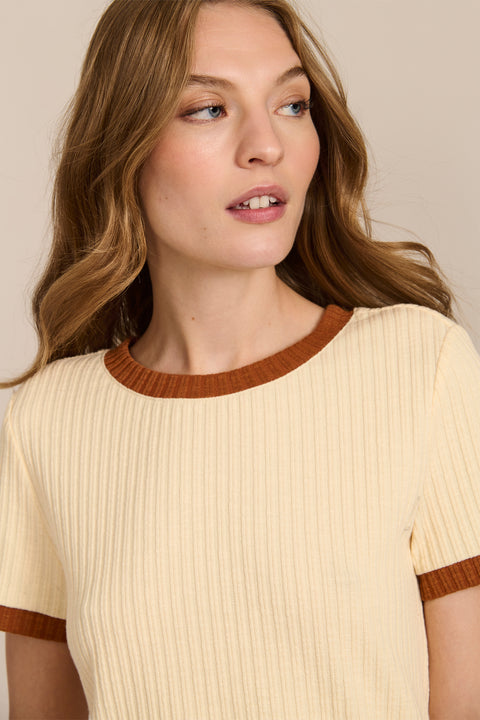 women's ivory ribbed knit short-sleeve tee featuring a crew neckline and warm brown contrast trim at the neck and cuffs.