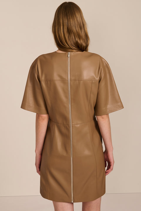 women's camel faux leather shift dress featuring short sleeves, a crew neckline, seam detailing and side pockets.
