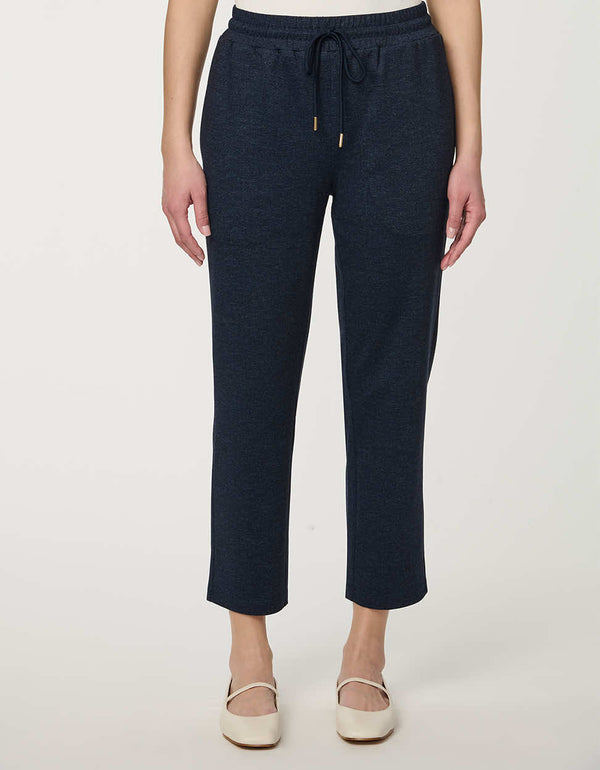Woman wearing denim-effect Slim Drawstring Pant with cropped straight-leg silhouette and adjustable waist.