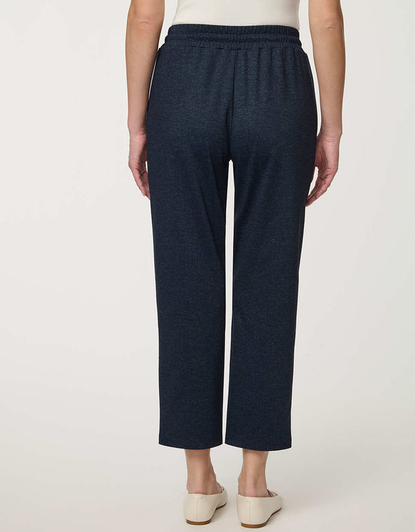 Woman wearing denim-effect Slim Drawstring Pant with cropped straight-leg silhouette and adjustable waist.