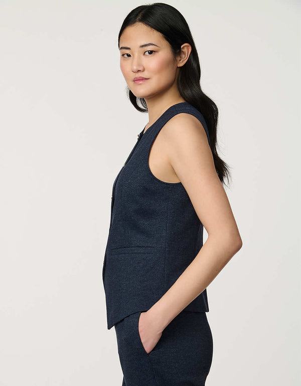 Woman wearing denim-effect Button Down Crew Neck Vest with crew neckline and tailored sleeveless silhouette.