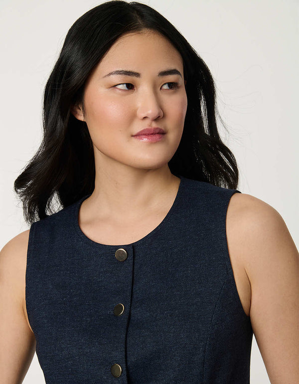 Woman wearing denim-effect Button Down Crew Neck Vest with crew neckline and tailored sleeveless silhouette.