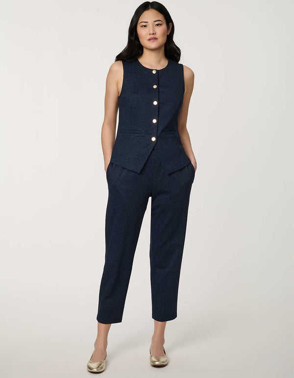 Woman wearing denim-effect Button Down Crew Neck Vest with crew neckline and tailored sleeveless silhouette.