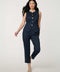 Woman wearing denim-effect Button Down Crew Neck Vest with crew neckline and tailored sleeveless silhouette.