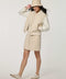 Woman wearing neutral Modern Varsity Jacket with contrast sleeves, ribbed trim, snap-front closure and welt pockets.