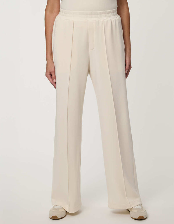 Woman wearing Scuba Pull-On Wide-Leg Pant with elastic waistband and elongated silhouette.