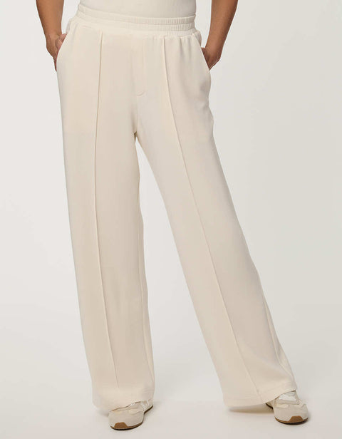 Woman wearing Scuba Pull-On Wide-Leg Pant with elastic waistband and elongated silhouette.