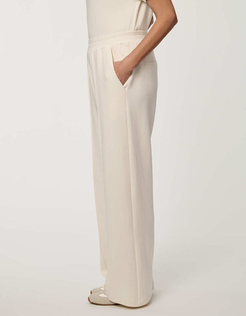 Woman wearing Scuba Pull-On Wide-Leg Pant with elastic waistband and elongated silhouette.