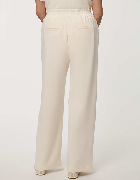 Woman wearing Scuba Pull-On Wide-Leg Pant with elastic waistband and elongated silhouette.
