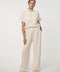 Woman wearing Scuba Pull-On Wide-Leg Pant with elastic waistband and elongated silhouette.