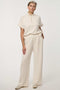 Woman wearing Scuba Pull-On Wide-Leg Pant with elastic waistband and elongated silhouette.
