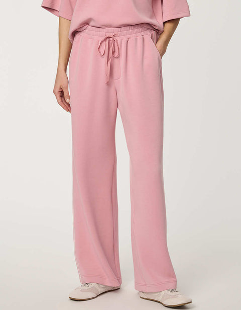 Woman wearing wide-leg Scuba Pull-On Pant with elastic waistband and subtle piping detail.